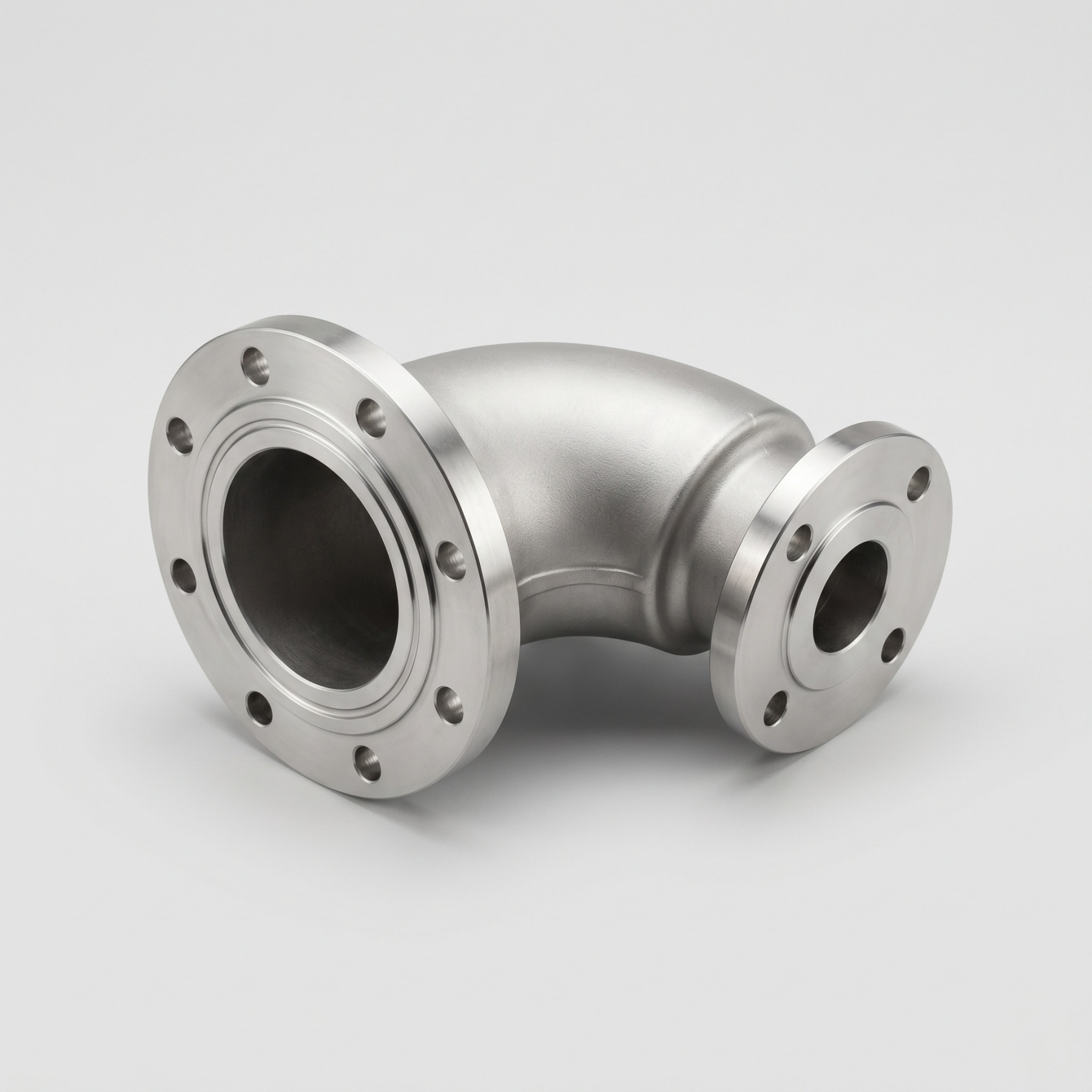 Custom cast reducing elbow for pump and piping systems