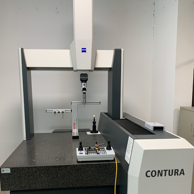 Coordinate measuring machine for precision dimensional inspection of cast metal parts